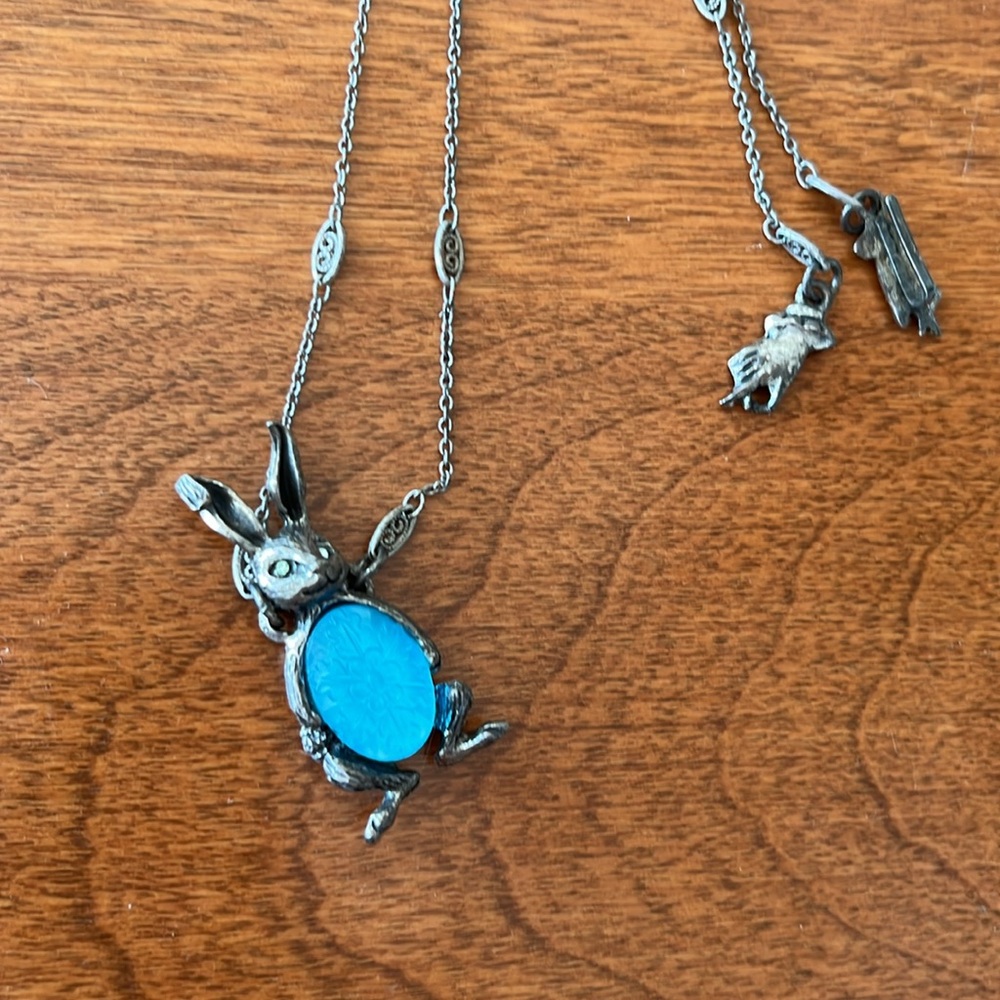 Rabbit necklace with magical blue glass belly